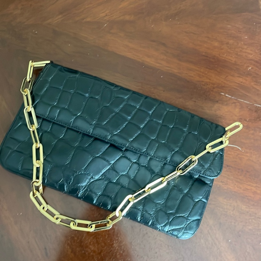 Black shoulder bag with gold chain